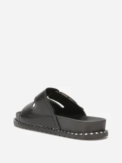 Online La Modeuse Mules avec deux brides et boucles décoratives Noir