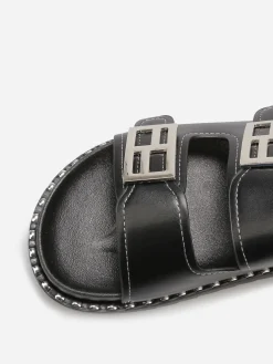 Online La Modeuse Mules avec deux brides et boucles décoratives Noir