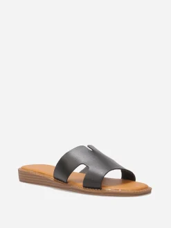 La Modeuse Mules compensées à bride ajourée Noir