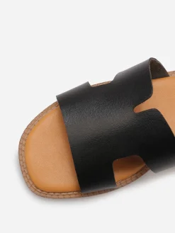 La Modeuse Mules compensées à bride ajourée Noir