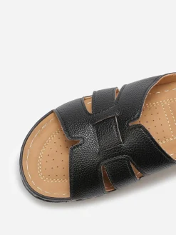 Sale La Modeuse Mules compensées à brides croisées Noir