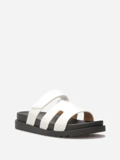 New La Modeuse Mules effet croco à brides ajourées Blanc