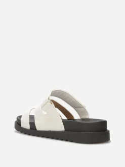 New La Modeuse Mules effet croco à brides ajourées Blanc