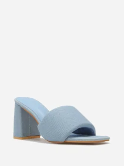 Discount La Modeuse Mules en denim à talon et bride rembourrée Bleu