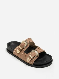 Discount La Modeuse Mules en suédine à boucles et clous dorés Taupe