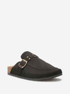 New La Modeuse Mules en suédine à bride et surpiqûres Noir
