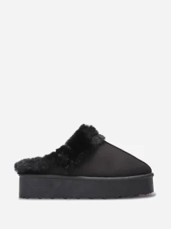 Sale La Modeuse Mules en suédine fourrées Noir