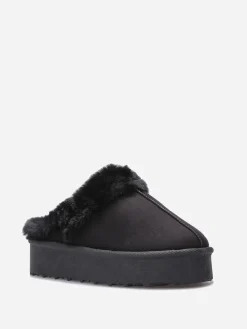 Sale La Modeuse Mules en suédine fourrées Noir