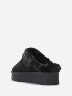 Sale La Modeuse Mules en suédine fourrées Noir