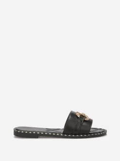 Outlet La Modeuse Mules plates à boucle et clous dorés Noir