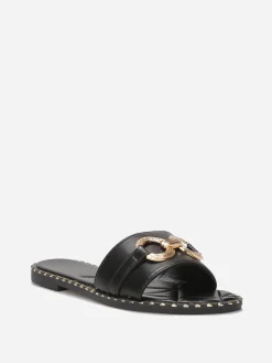 Outlet La Modeuse Mules plates à boucle et clous dorés Noir