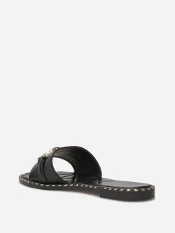Outlet La Modeuse Mules plates à boucle et clous dorés Noir