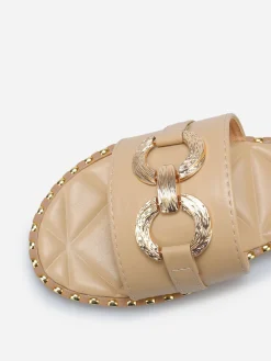 New La Modeuse Mules plates à boucle et clous dorés Taupe
