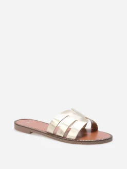 La Modeuse Mules plates à bride ajourée et clous Doré