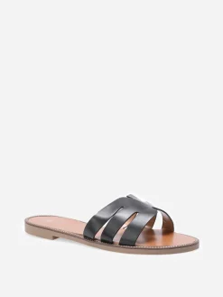 La Modeuse Mules plates à bride ajourée et clous Noir