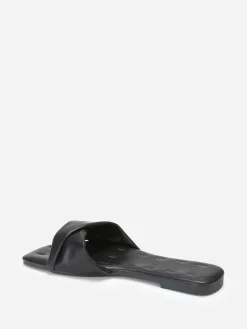 La Modeuse Mules plates à bride torsadée en simili Noir