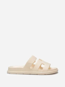 Discount La Modeuse Mules plates à brides ajourées Beige