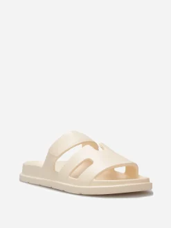 Discount La Modeuse Mules plates à brides ajourées Beige