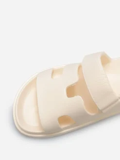 Discount La Modeuse Mules plates à brides ajourées Beige