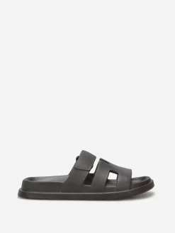 Discount La Modeuse Mules plates à brides ajourées Noir