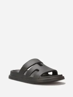Discount La Modeuse Mules plates à brides ajourées Noir