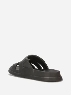 Discount La Modeuse Mules plates à brides ajourées Noir