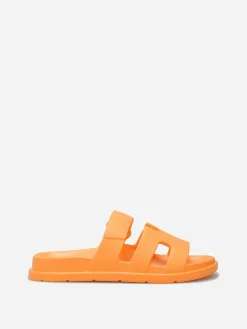La Modeuse Mules plates à brides ajourées Orange