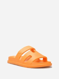 La Modeuse Mules plates à brides ajourées Orange