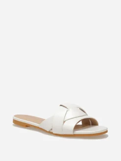 Discount La Modeuse Mules plates à brides entrecroisées Blanc