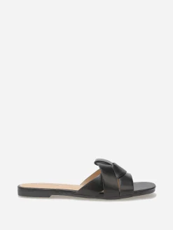Outlet La Modeuse Mules plates à brides entrecroisées Noir