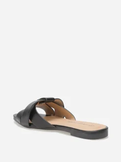 Outlet La Modeuse Mules plates à brides entrecroisées Noir