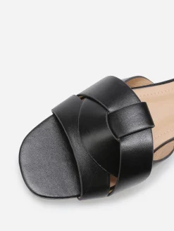 Outlet La Modeuse Mules plates à brides entrecroisées Noir