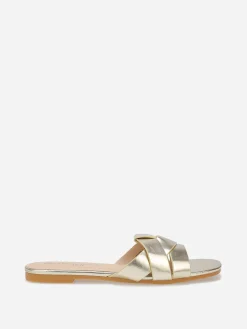 New La Modeuse Mules plates à brides entrecroisées Doré