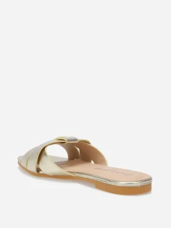 New La Modeuse Mules plates à brides entrecroisées Doré