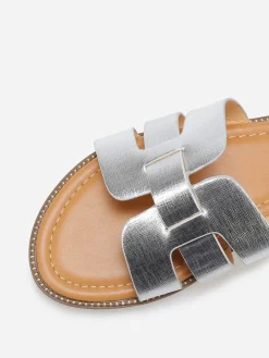 Online La Modeuse Mules plates à brides texturées et entrecroisées Argenté