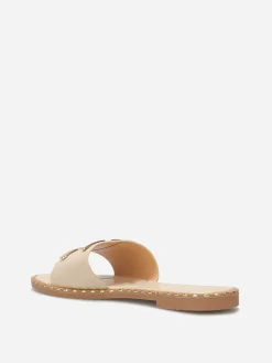 Discount La Modeuse Mules plates à détails dorés Beige