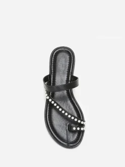 La Modeuse Mules plates à fines brides et perles Noir