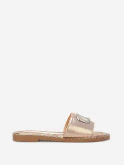 Outlet La Modeuse Mules plates à strass et clous Dorérose