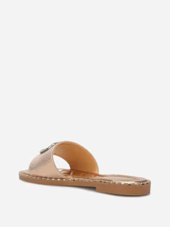 Outlet La Modeuse Mules plates à strass et clous Dorérose
