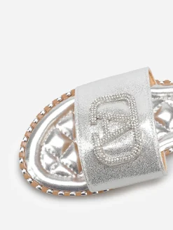 New La Modeuse Mules plates à strass et clous Argenté