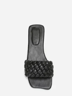La Modeuse Mules plates carrées à bride tressée Noir