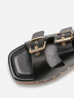 La Modeuse Mules sabots à boucles et clous Noir