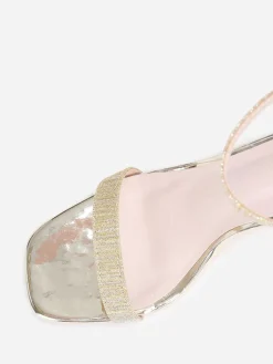 La Modeuse Sandales bi-matières vernies et pailletées Doré