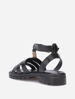 Online La Modeuse Spartiates à semelle crantée et bijou doré Noir