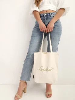 New La Modeuse Tote bag à inscription "bonheur" Blanc